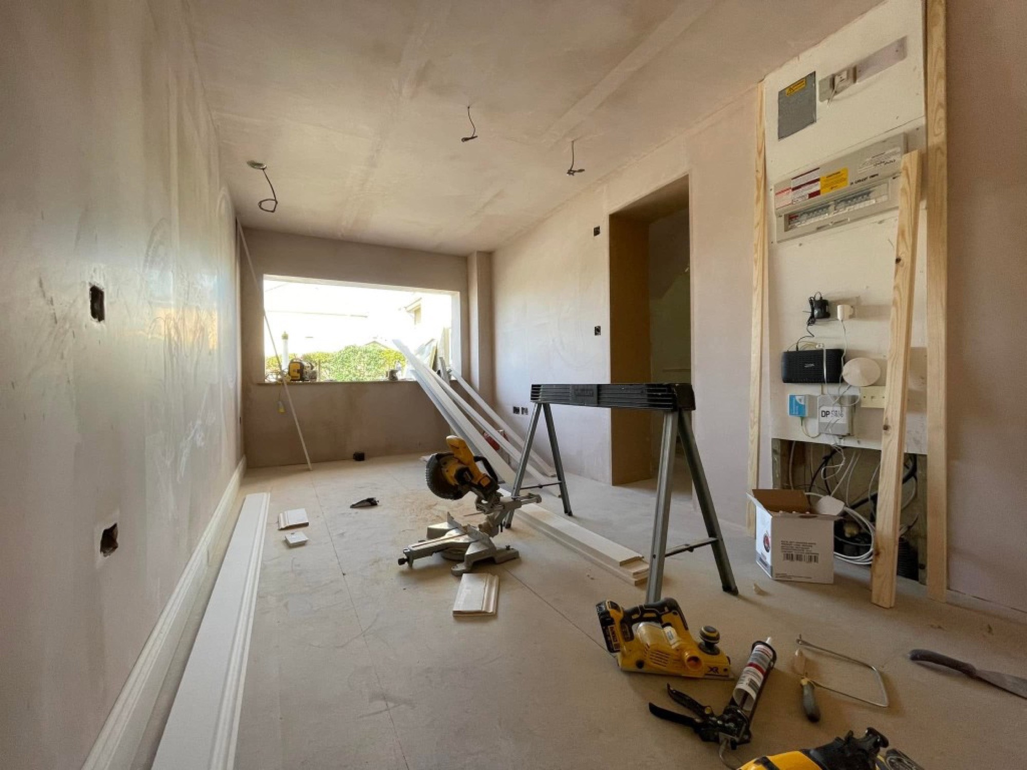 Garage conversion — plastering and interior fit-out in progress